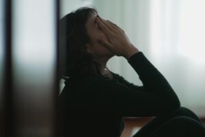 A woman thinking about depression in new mothers